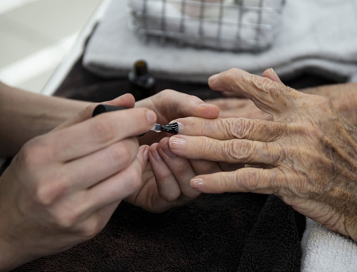 Garden Plaza resident Dolores Hodge has her nails styled for free Thursday afternoon at Tony and Guy.
