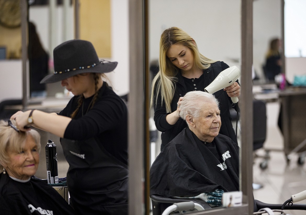 Photos: LOREN BENOIT/Press
Tony &amp; Guy stylist Ariel Smith blowdries Dorthy Sales&#146; hair for free Thursday afternoon in preparation for Mother&#146;s Day. Thirteen Garden Plaza of Post Falls residents enjoyed a day at the hairdressing academy.
