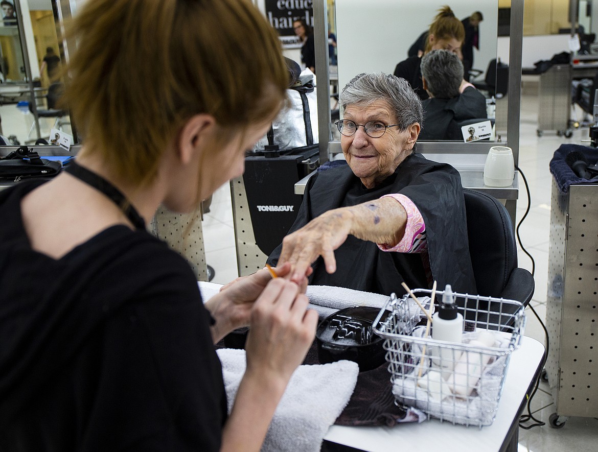 Stylist Hattie Hudson does Dolores Hodge&#146;s nails Thursday afternoon at Tony and Guy. Sales and other Garden Plaza residents had their hair and nails done for free in honor of Mother&#146;s Day. (LOREN BENOIT/Press)