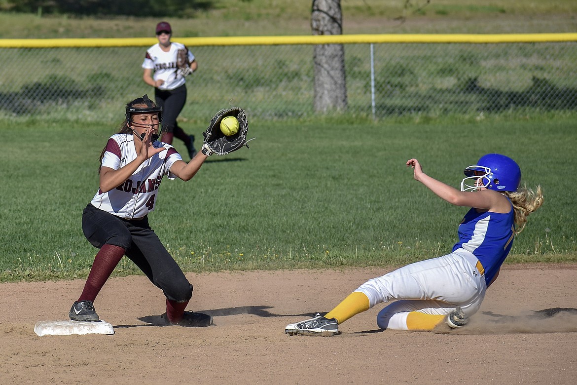 Troy sophomore second baseman Izzy Ramirez has Thompson Falls&#146; Riley Wilson out at second in the fourth inning of the Lady Trojans&#146; 16-14 play-in win against the Lady Hawks Tuesday. (Ben Kibbey/The Western News)