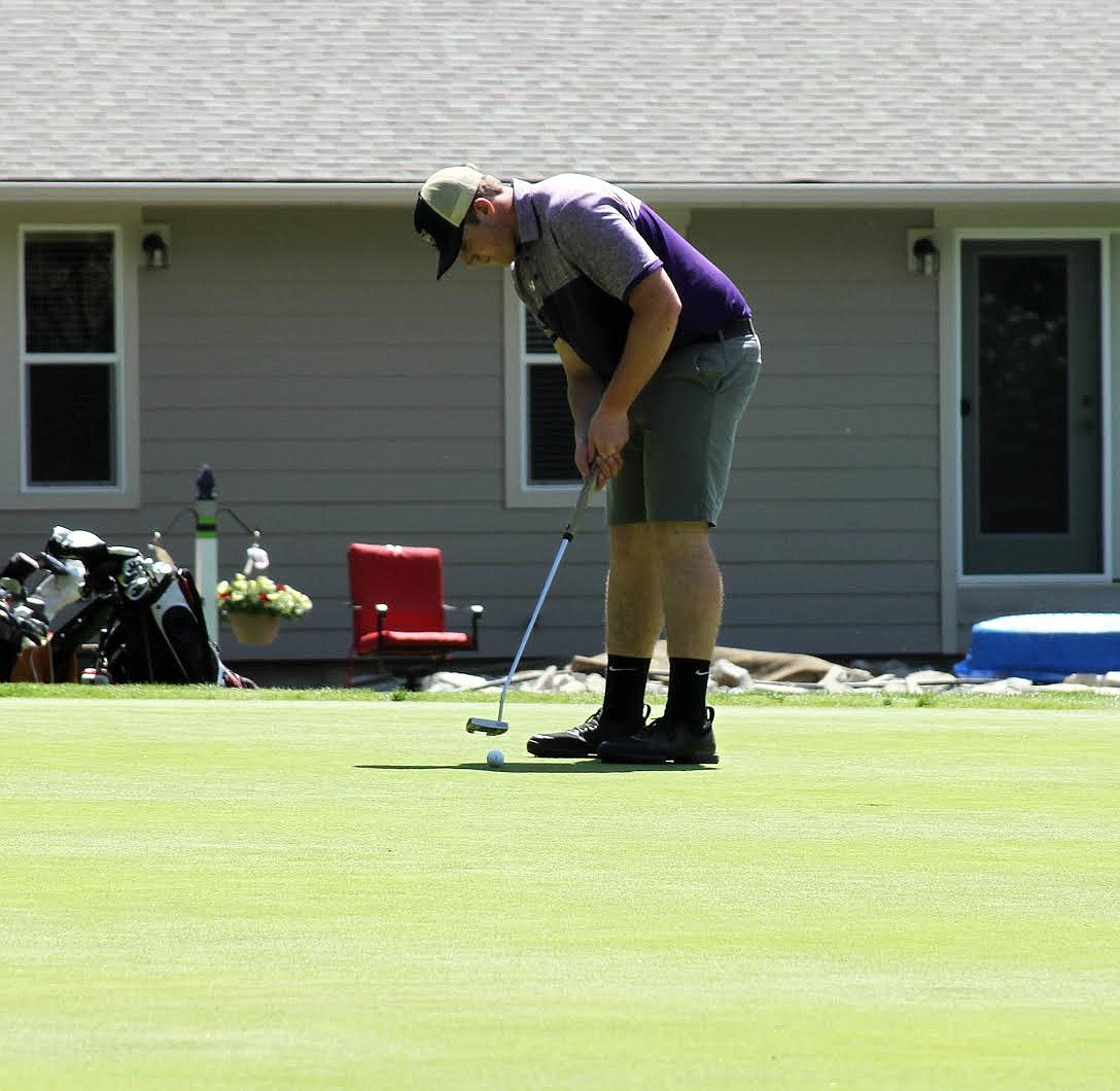 Cade Finlay shows off his short game during the state golf competition.