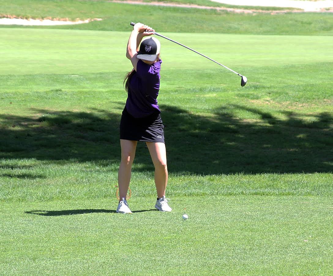 Photos by Josh and Caleb McDonald 
Kellogg&#146;s Morgan Nusz tees off during the opening day of the 3A state golf competition.