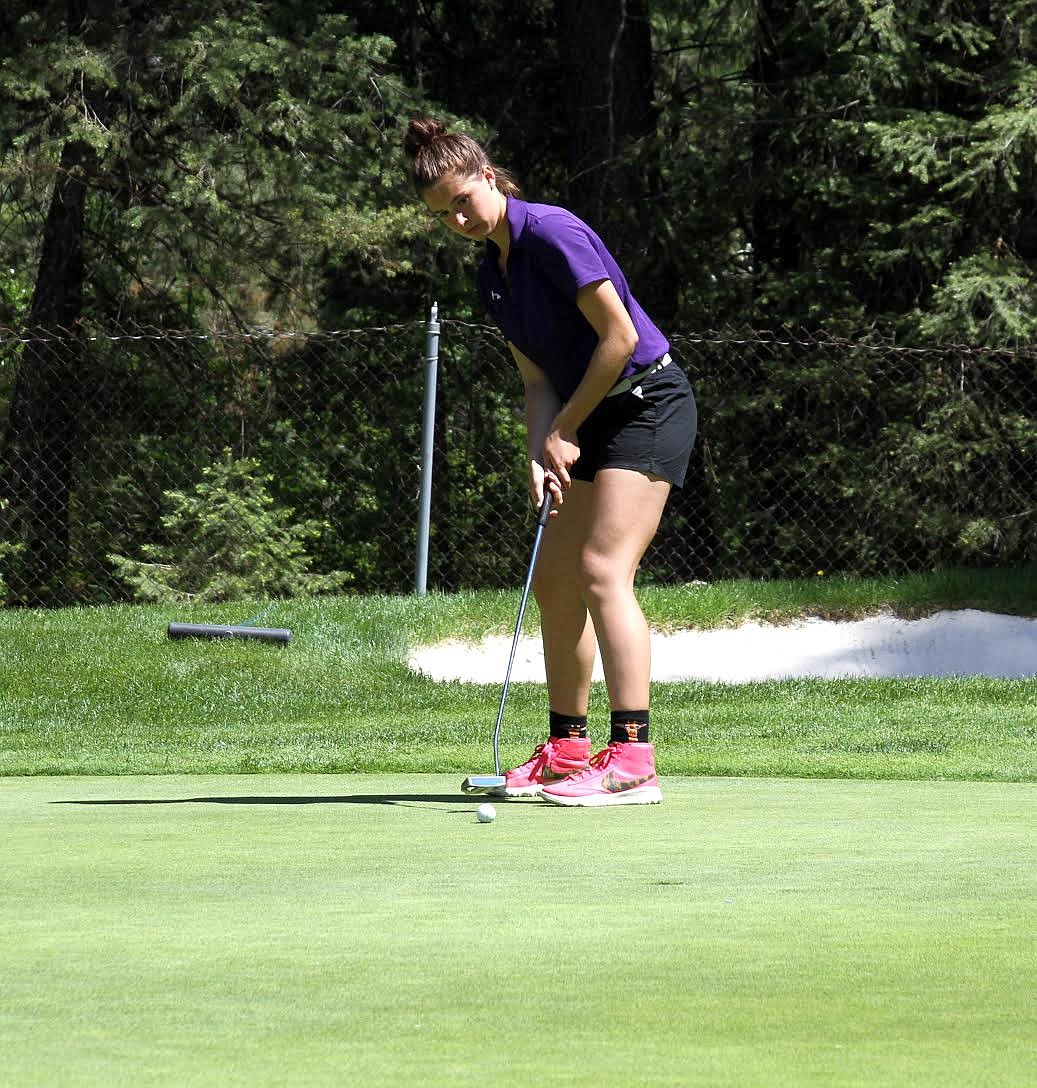 Kat Rauenhorst sinks a put during her laser focused second round at the 3A state golf competition.