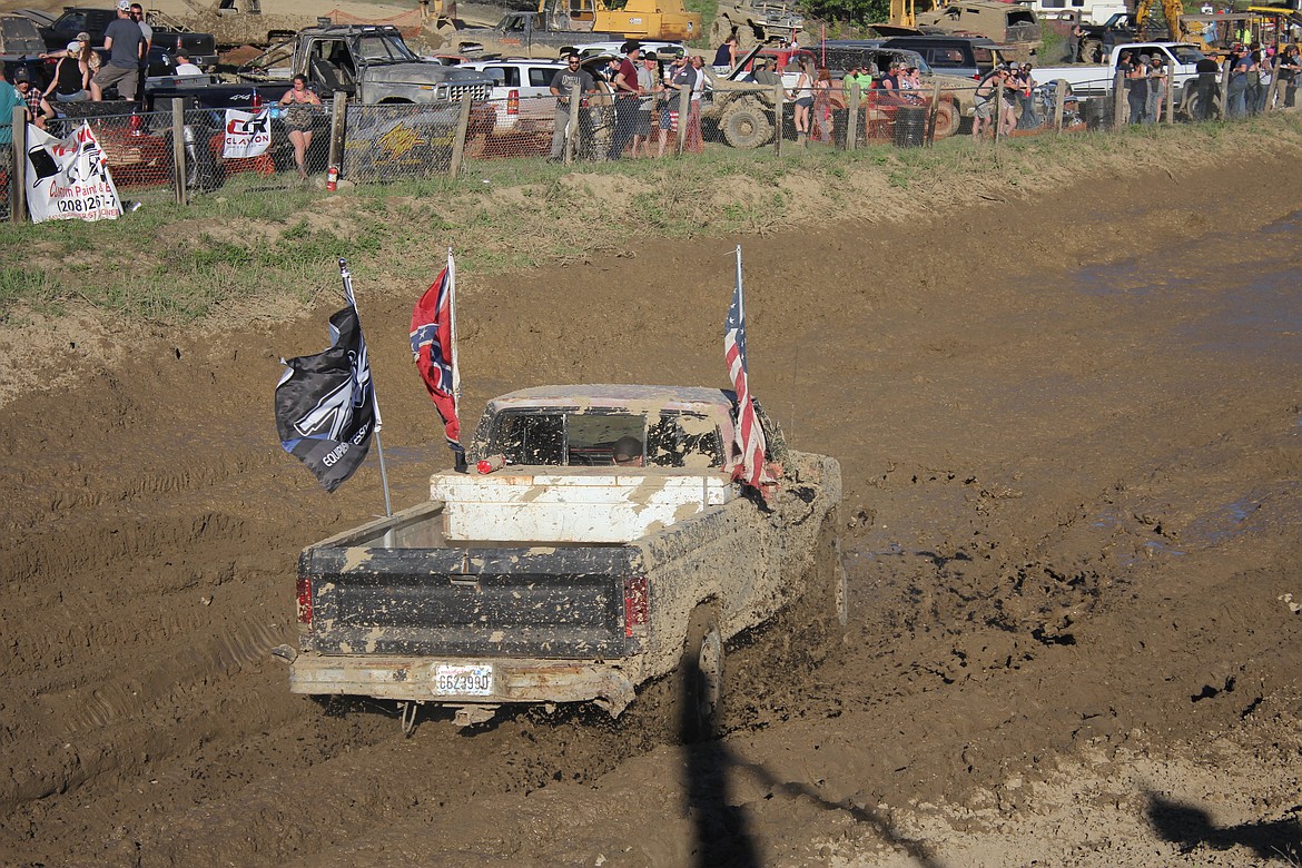 Photo by TANNA YEOUMANS
Sporting flags, this mud bog attendee got more than the truck muddy.