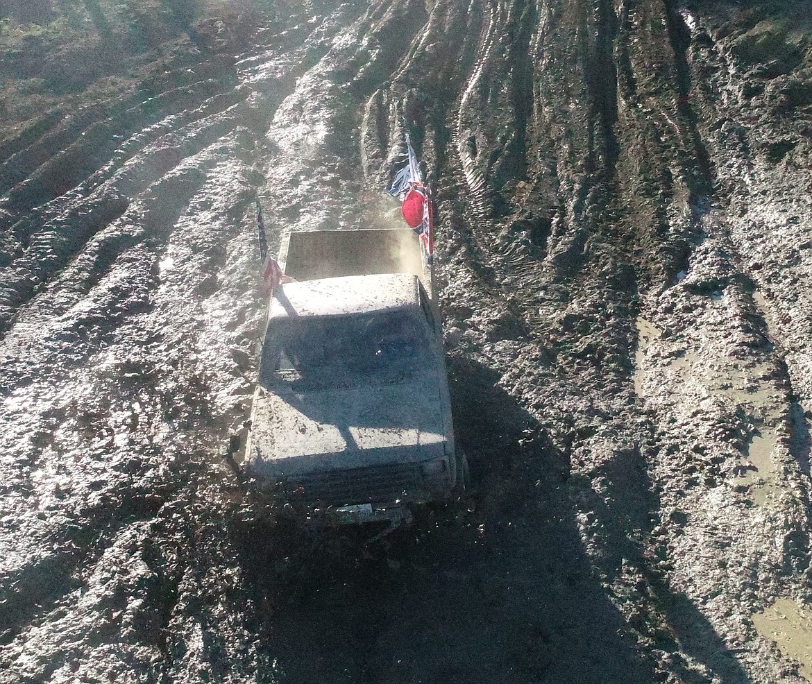 Photo by LEE YEOUMANS
The mud got deep towards the far side of the pit, and some people got stuck, but this bogger pushed through as far as they could.