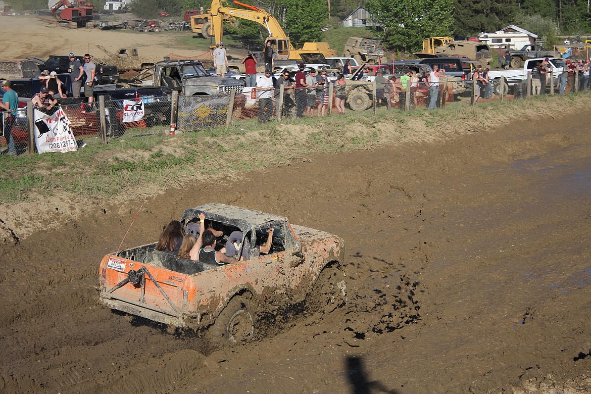 Teresa Lummus, local History Channel celebrity, rolls through the mud pit with enthusiastic passengers.