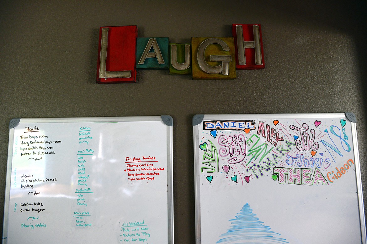 Whiteboards with the Horton childrens&#146; names and household projects are evidence of a busy household in the Horton home in Kalispell. (Casey Kreider/Daily Inter Lake)