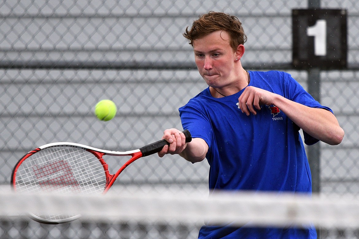 Bigfork&#146;s Emmett Aschim hits a return against Troy&#146;s AJ Faur at Montana Athletic Club-Bigfork on Friday. (Casey Kreider/Daily Inter Lake)