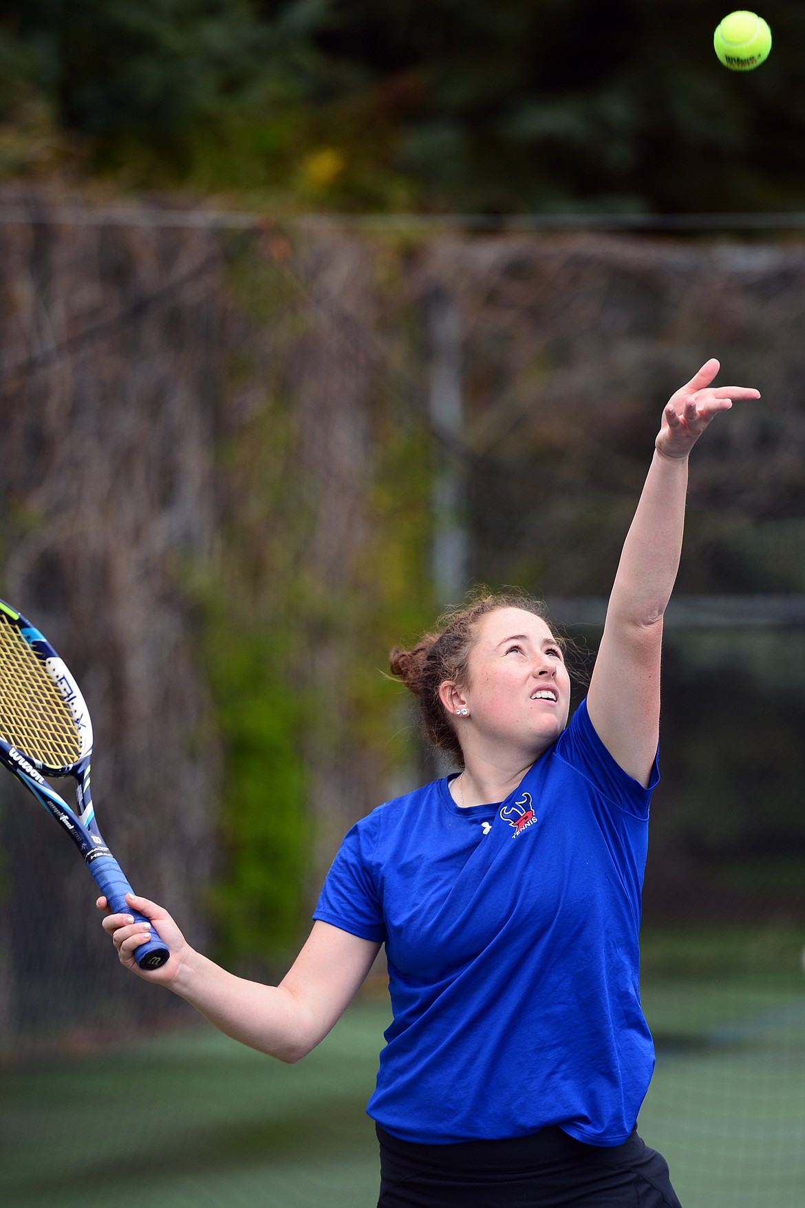 Bigforks Ellie Berreth serves in a match against Bigfork teammate Lara Guenzler at Montana Athletic Club-Bigfork on Friday. (Casey Kreider/Daily Inter Lake)
