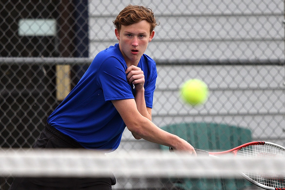 Bigfork&#146;s Emmett Aschim serves against Troy&#146;s AJ Faur at Montana Athletic Club-Bigfork on Friday. (Casey Kreider/Daily Inter Lake)