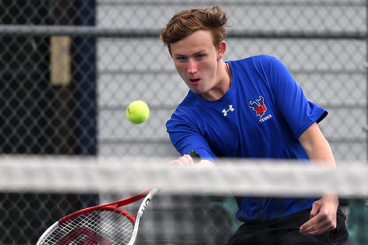 Bigfork&#146;s Emmett Aschim hits a return against Troy&#146;s AJ Faur at Montana Athletic Club-Bigfork on Friday. (Casey Kreider/Daily Inter Lake)