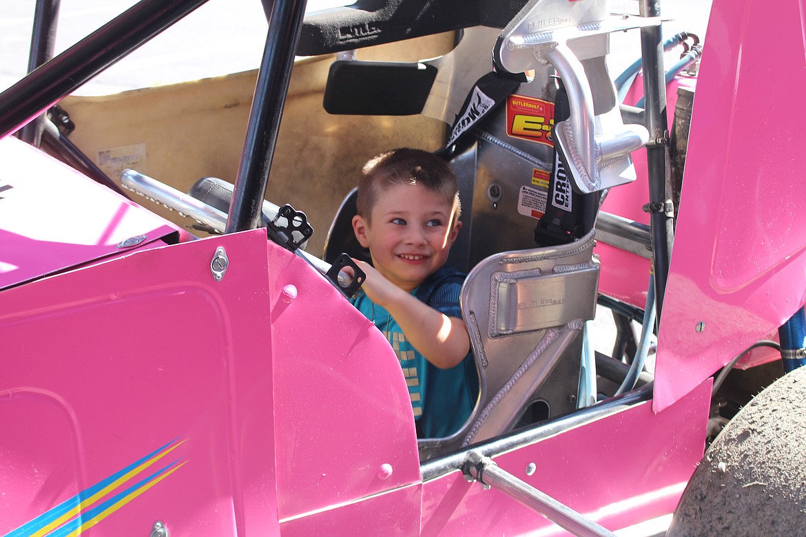 Cheryl Schweizer/Columbia Basin Herald
Excited kids were allowed to hold the wheel in a real race car during &#145;Touch a Truck&#146; Saturday in Ephrata.