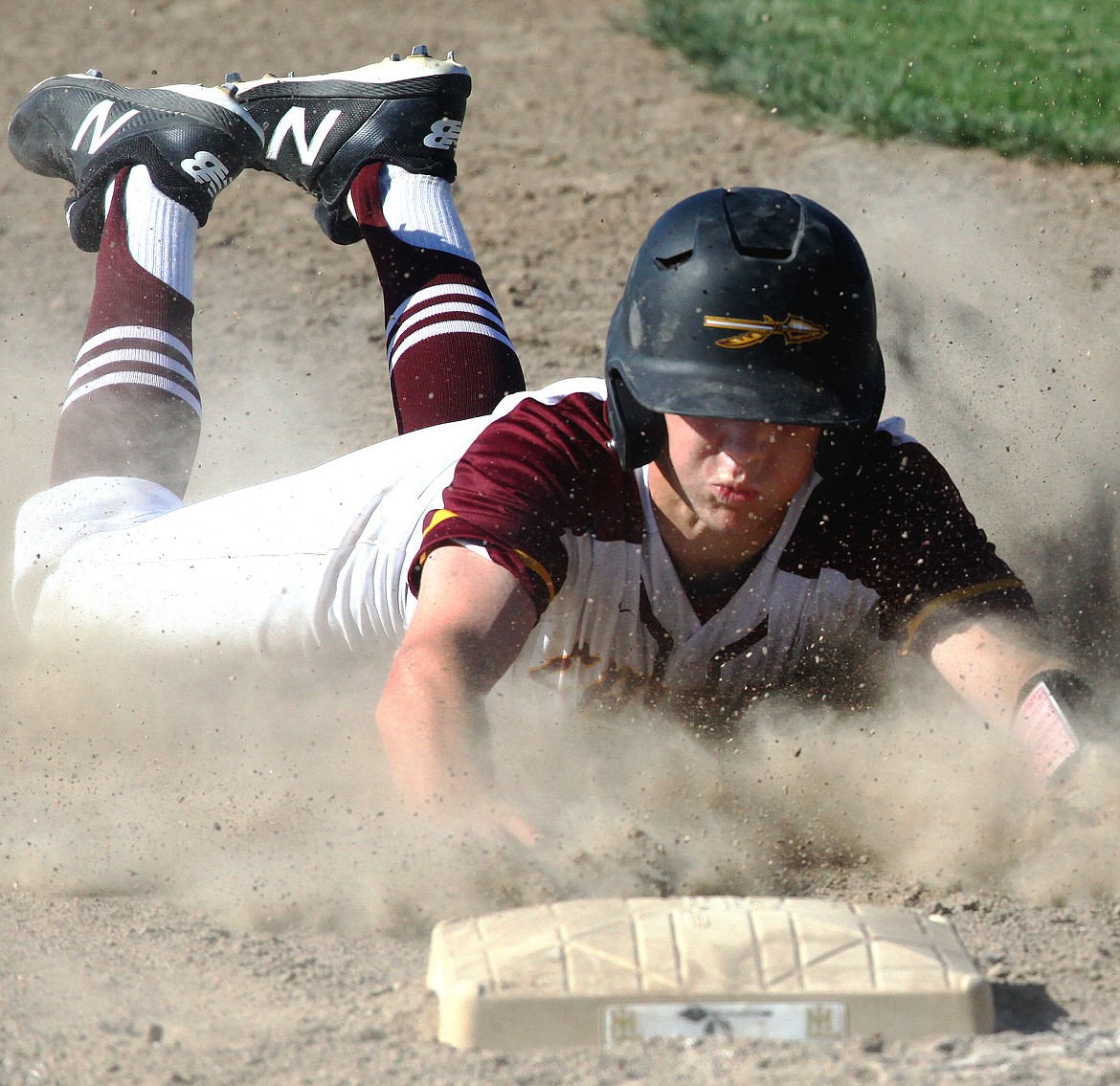 Rodney Harwood/Columbia Basin Herald
Moses Lake runner Gabe Passey slides into third base during Saturday's 4A District 6 championship game against Wenatchee at Larson Playfield.