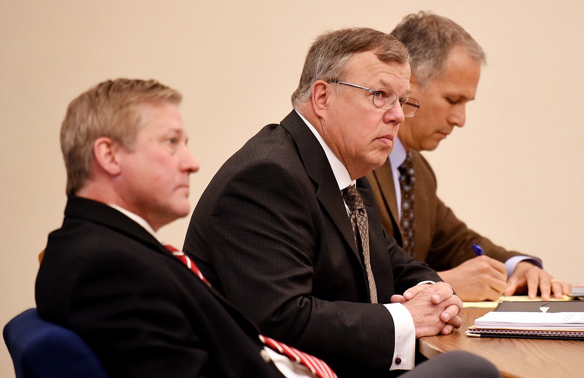 flathead County Commissioner Phil Mitchell and his attorneys at his change of plea hearing on Friday at Flathead District Court in Kalipsell. (Brenda Ahearn/Daily Inter Lake)