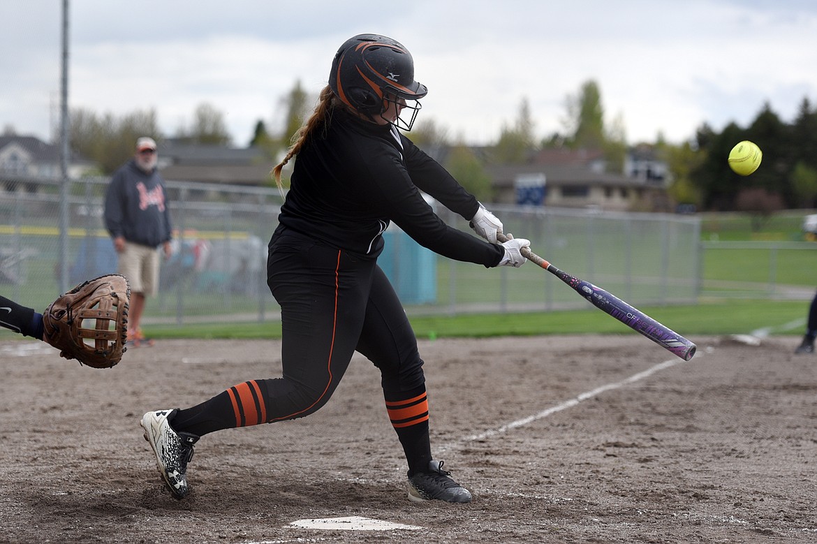 Flathead&#146;s Hailey Junk connects on a 2-run home run in the first inning against Glacier at Kidsports Complex on Thursday. (Casey Kreider/Daily Inter Lake)