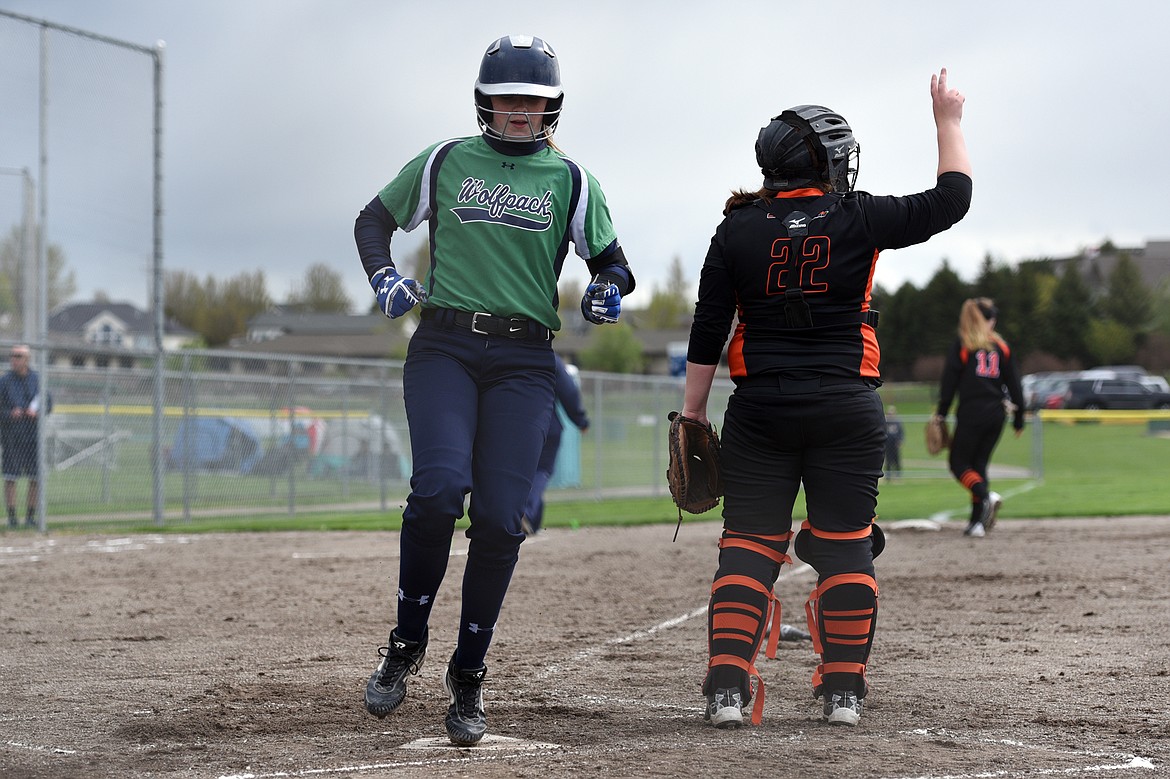 Glacier&#146;s Kynzie Mohl scores on an RBI single by Addie Labrum in the first inning against Flathead at Kidsports Complex on Thursday. (Casey Kreider/Daily Inter Lake)