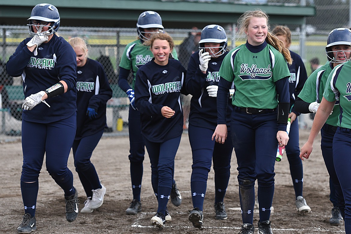 Glacier celebrates after Allee Meyer&#146;s 2-run home run in the second inning against Flathead at Kidsports Complex on Thursday. (Casey Kreider/Daily Inter Lake)