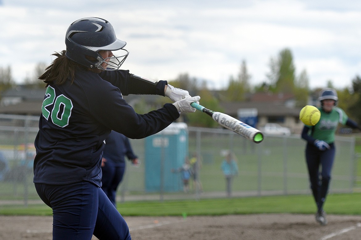 Glacier&#146;s Allee Meyer connects on 2-run home run in the second inning against Flathead at Kidsports Complex on Thursday. (Casey Kreider/Daily Inter Lake)