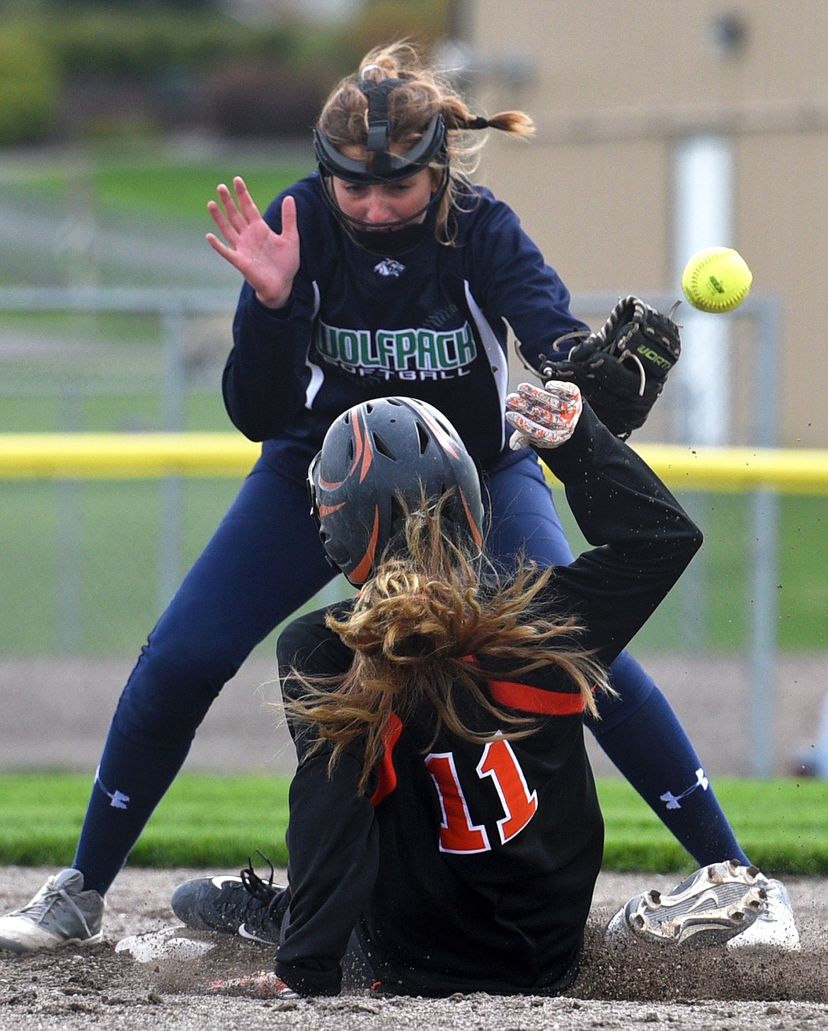 Flathead&#146;s Kaileigh Denna steals second base as Glacier shortstop Jennifer Wallace bobbles the throw at Kidsports Complex on Thursday. (Casey Kreider/Daily Inter Lake)