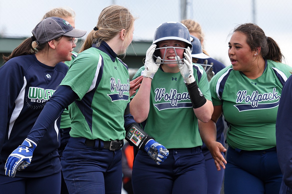 Glacier celebrates at home plate after Maddie Johnson&#146;s solo home run in the third inning against Flathead at Kidsports Complex on Thursday. (Casey Kreider/Daily Inter Lake)