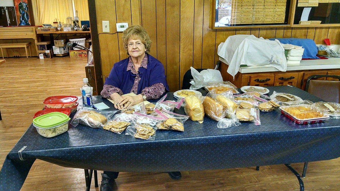 Shirley Boles mans the baked-goods table at the recent Plains-Paradise Senior Center Spring Bazaar. (Clark Fork Valley Press)