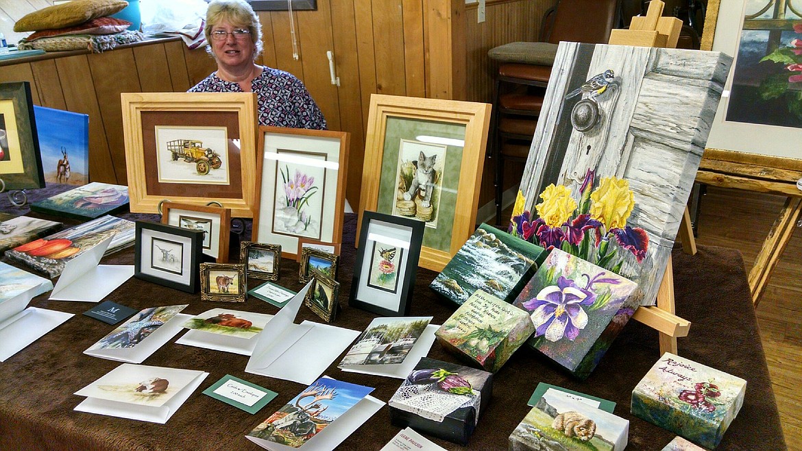 Ilene Paulsen showcases some gorgeous art work for sale to brighten up any home during the Spring Bazzar recently (Clark Fork Valley Press)