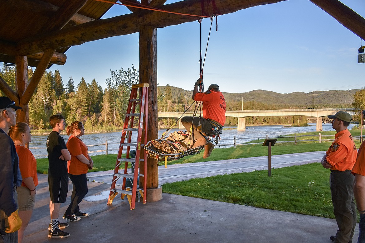 David Thompson Search and Rescue volunteer Noah Pyle demonstrates positions a rescuer might use while attending to a patient being extracted up a cliff face during monthly training, May 7 for the SAR Junior Unit, May 7. (Benjamin Kibbey/The Western News)