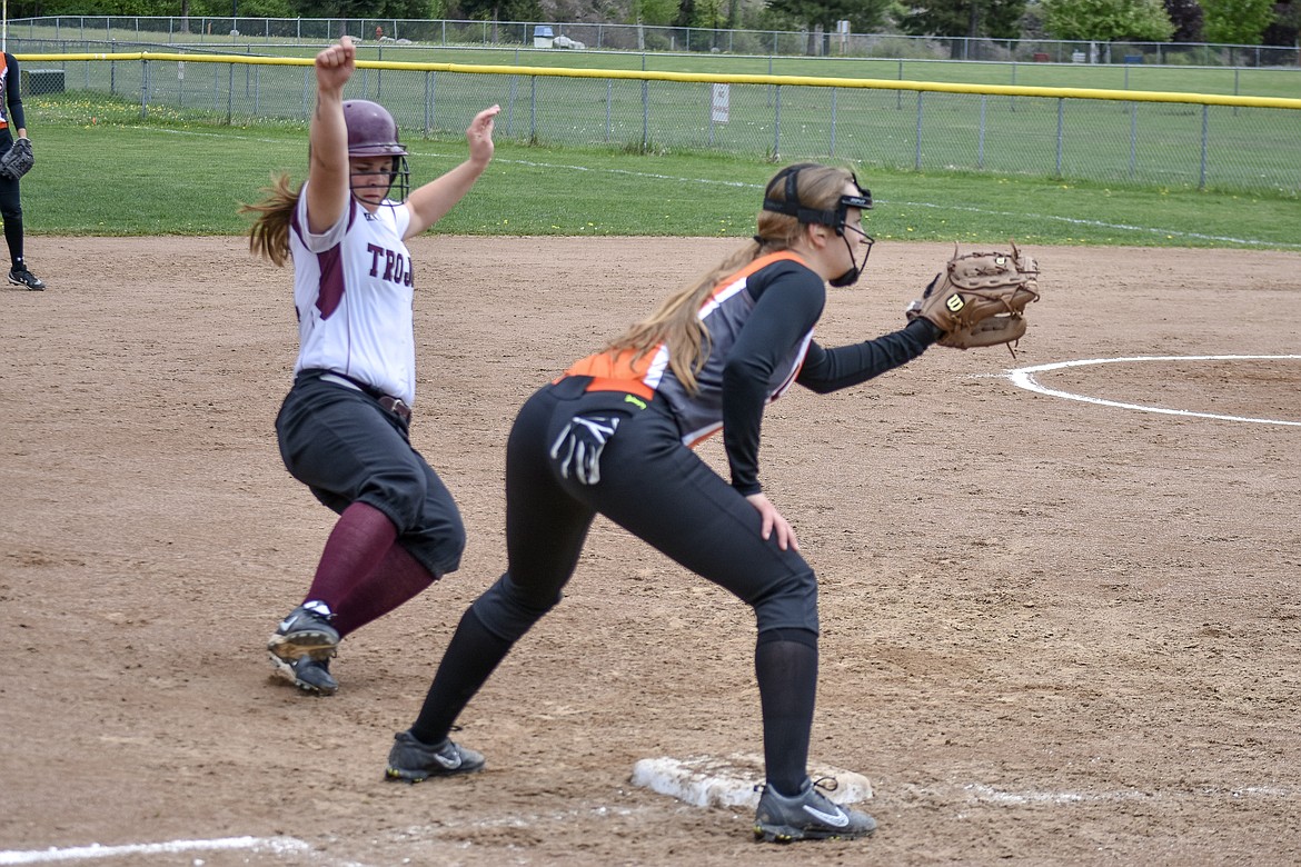 Going in for a slide, Troy junior Cami Finley steals third during the fifth inning of Troy&#146;s first game against Eureka on Friday.  (Benjamin Kibbey/The Western News)