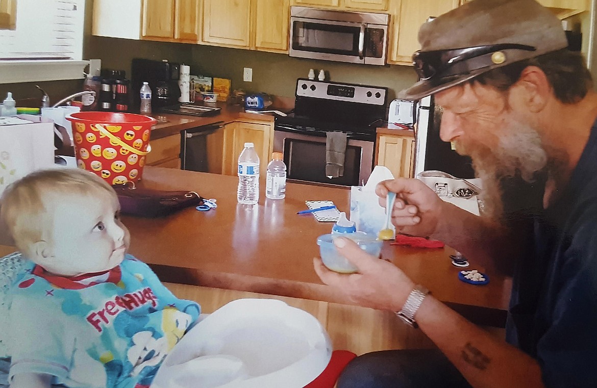 Donnie Smith feeds grandson Jeren Nielson in May 2017, when the boy was 10 months old. (Courtesy photo)