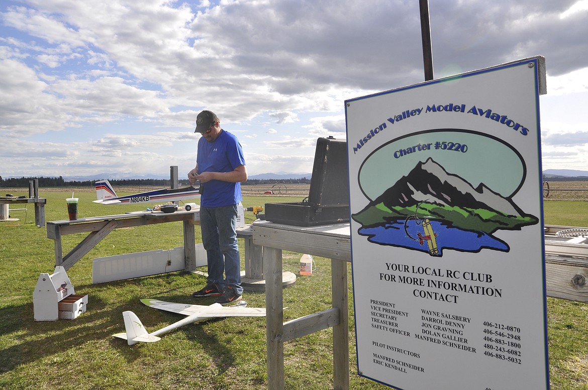 ERIK Kendall preps one of his model planes during a late April afternoon. (Ashley Fox/Lake County Leader)