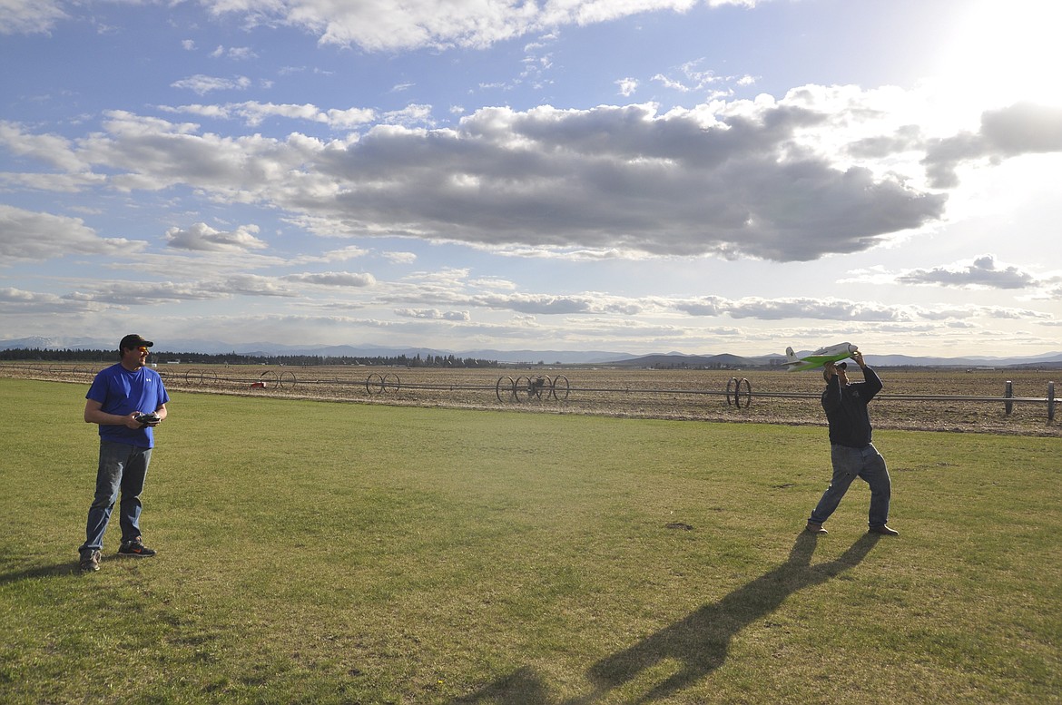 ERICH SPIDEL, left, launches a model plane for Eric Kendall. Both are members of the Mission Valley Model Aviators. (Ashley Fox/Lake County Leader)