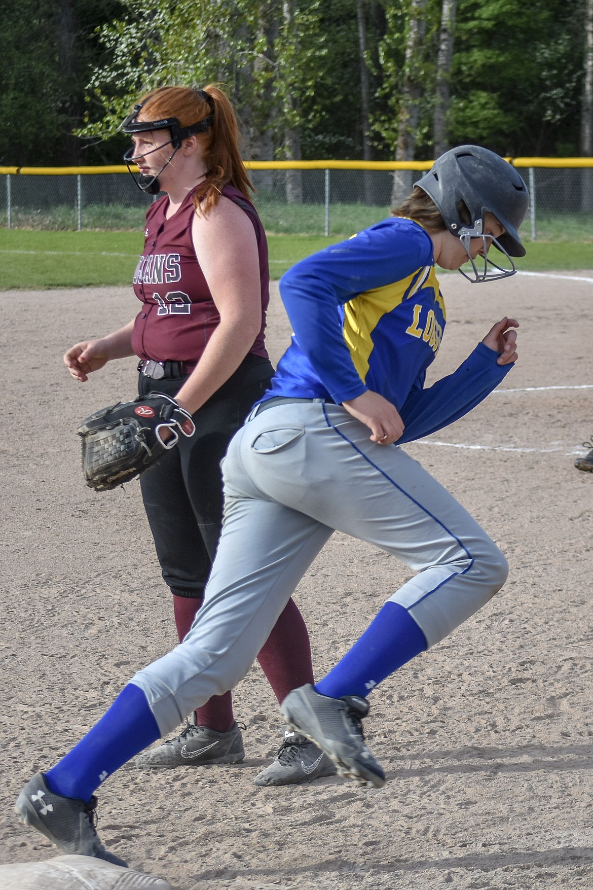 Libby freshman Taylor Holm rounds third on her way to make the score 7-3, Libby, during the second inning of the second game of the Libby-Troy double header Tuesday, May 8. (Ben Kibbey/The Western News)