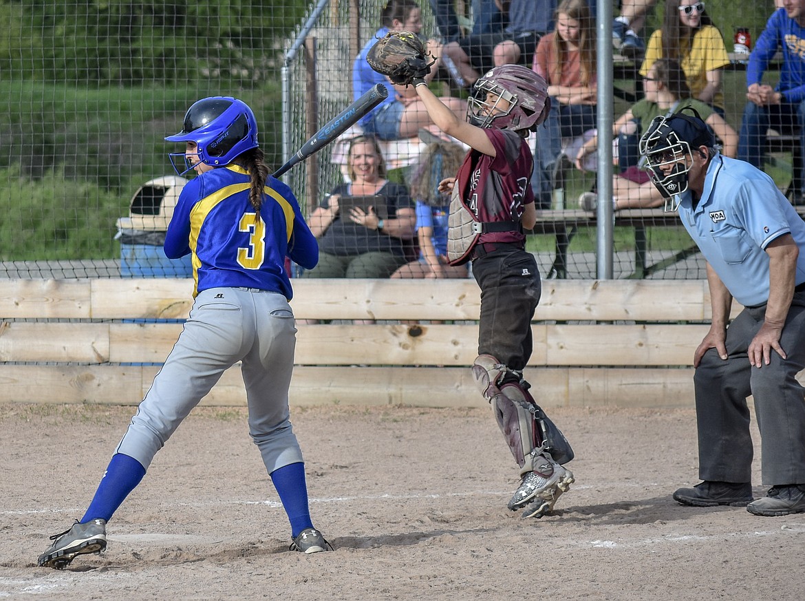 Troy junior Kaylee Tunison jumps to catch a high ball with freshman Kayley Svendsbye at bat during the second inning of the second game of the Libby-Troy double header Tuesday, May 8. (Ben Kibbey/The Western News)