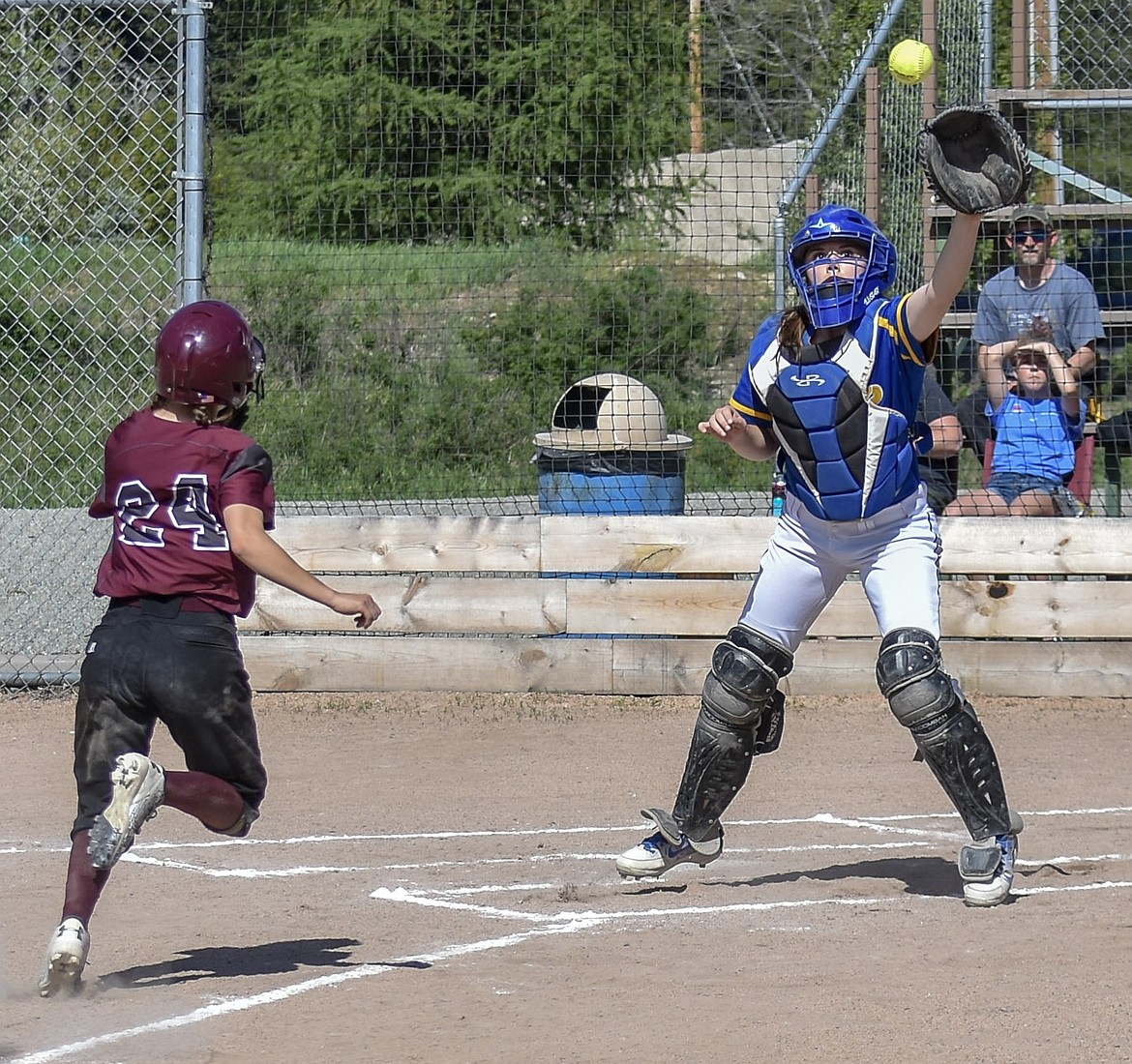 Libby sophomore Sheyla Gallagher reaches for the catch in a close play where junior Kaylee Tunison scored the first run of the Libby-Troy double header Tuesday, May 8 (Ben Kibbey/The Western News)