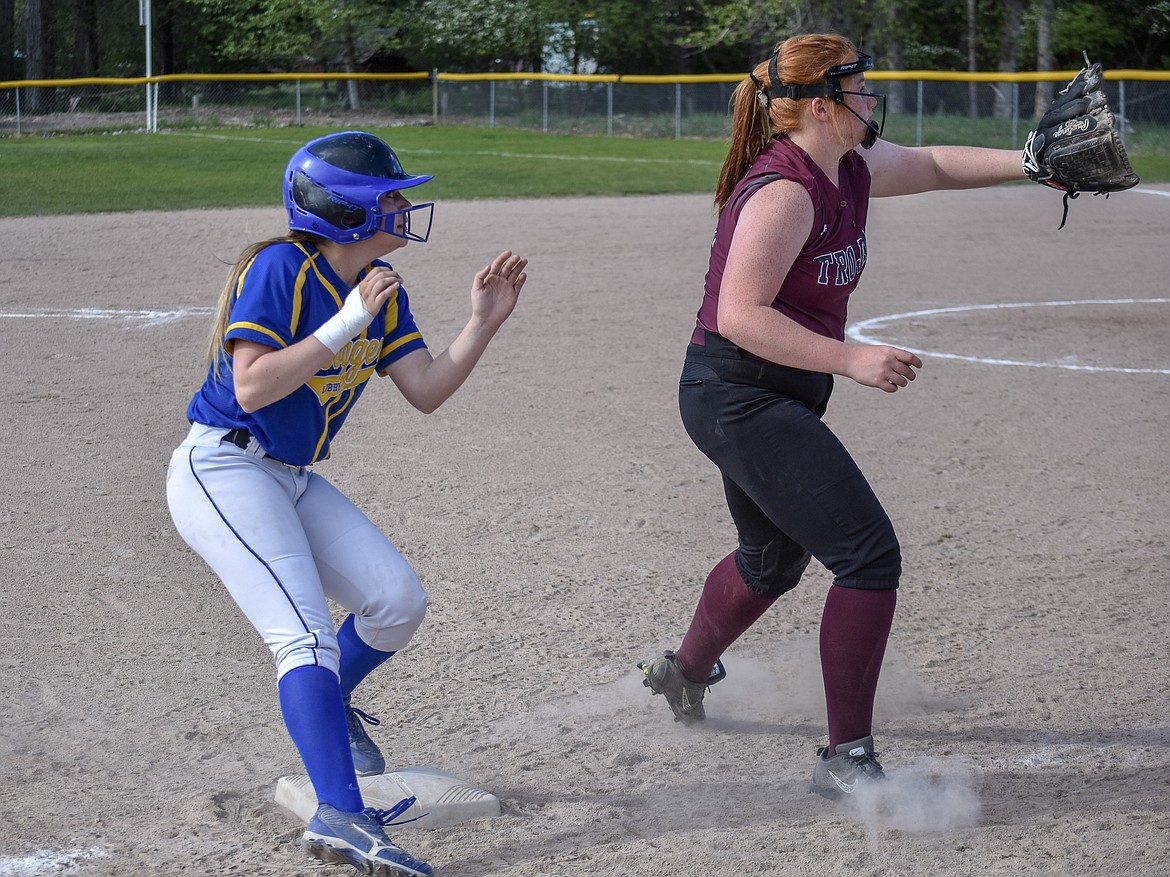 Libby sophomore Amaya Borden reaches third safe with an eye for the catch by sophomore third baseman Montana Rice after advancing on a wild pitch during the final inning of the first game of the Libby-Troy double header Tuesday, May 8 (Ben Kibbey/The Western News)