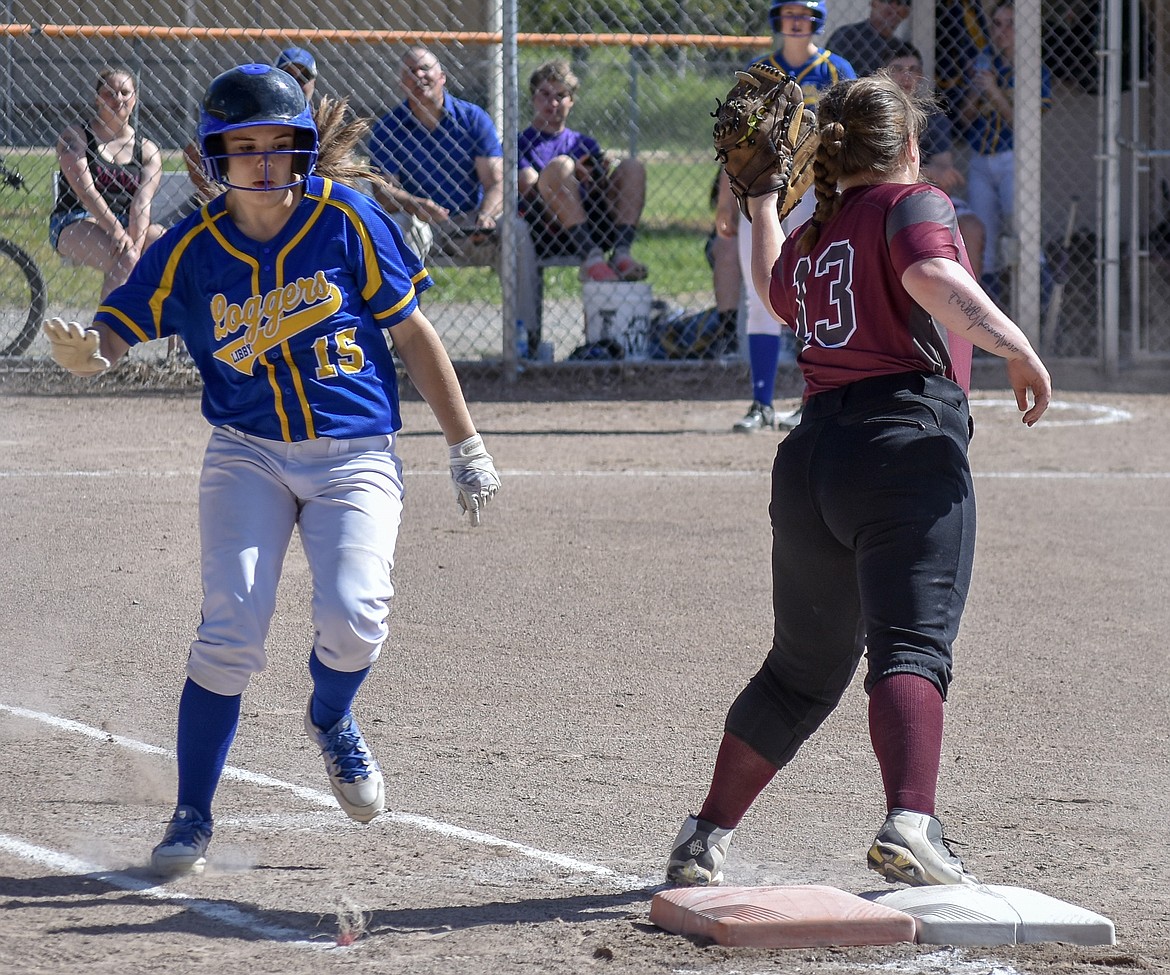 Libby sophomore Sheyla Gallagher is caught out at first by Troy junior Tristyn Winebark after a ground out to sophomore third baseman Montana Rice, ending the first inning of game one of the Libby-Troy double header Tuesday, May 8 (Ben Kibbey/The Western News)