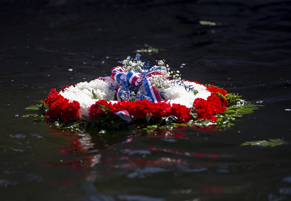 A wreath floats in Lake Coeur d'Alene in observance of Memorial Day during the city's observance at Veterans Plaza on Monday. (LOREN BENOIT/Press)