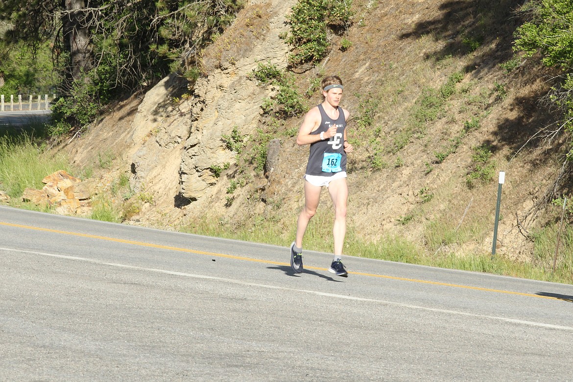 JASON ELLIOTT/Press
Post Falls High product Jacob Wimpenny runs with an early lead along Coeur d&#146;Alene Lake Drive during Sunday&#146;s Coeur d&#146;Alene Marathon. Wimpenny, who went on to run at Lewis-Clark State College, finished second overall.