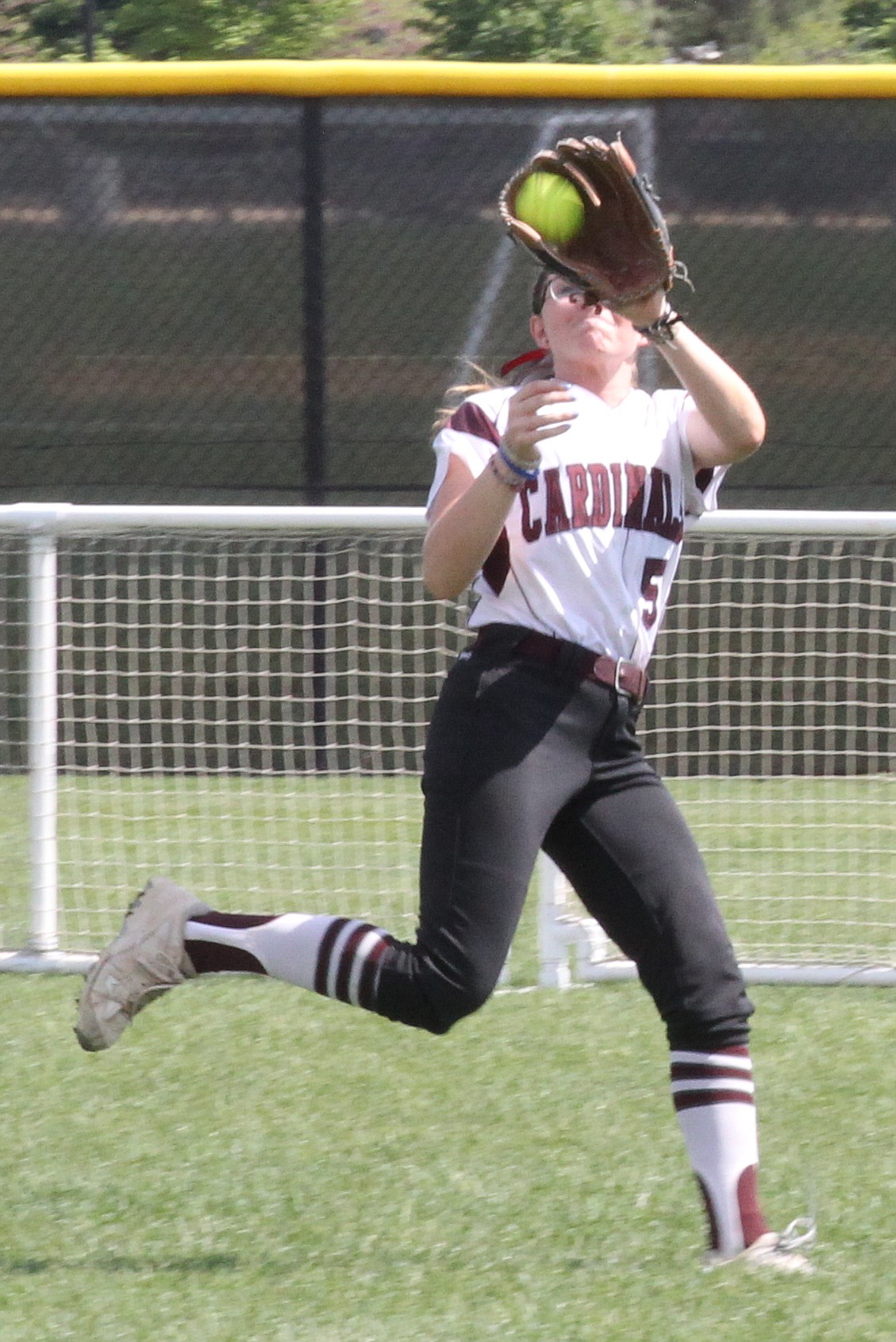NIC center fielder Natalie Schwab makes a running catch in the title game.