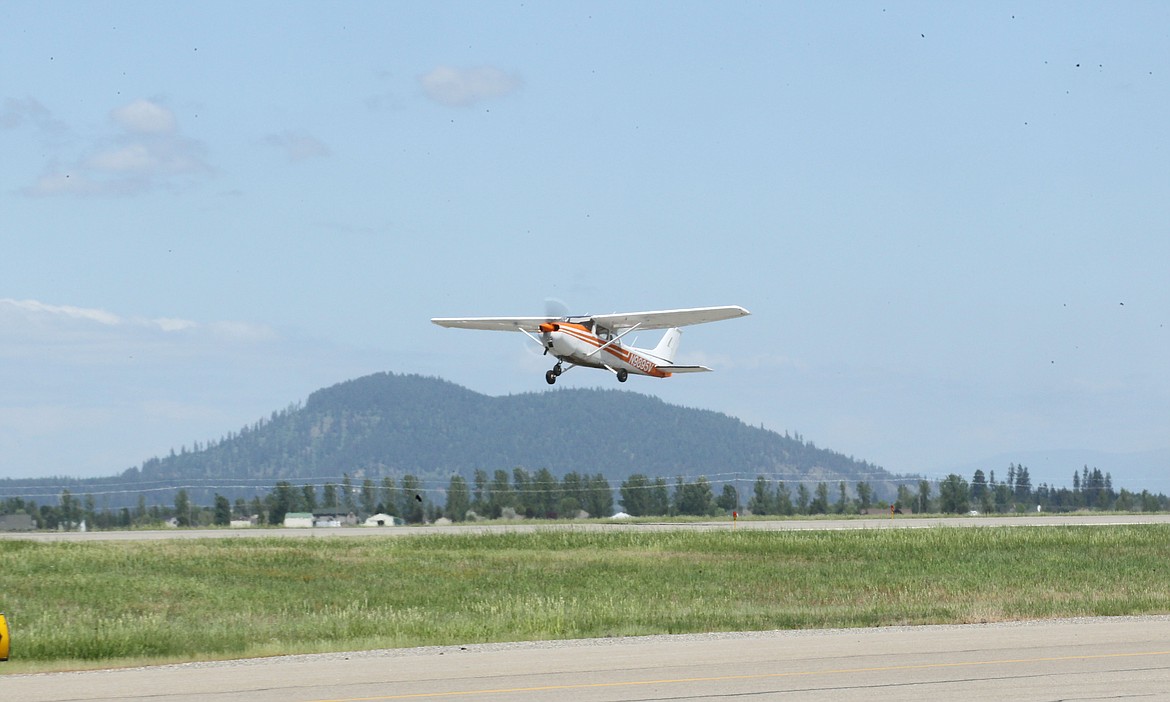 This orange and white Cessna 172 takes off into the sky from the airstrip at the Resort Aviation Jet Center in Hayden on Saturday afternoon. It is being flown by 17-year-old Riley Stevens with help of pilot Darrell Kisler as part of Riley&#146;s graduation from S.O.A.R.I.N.G., a program that helps kids work through their problems using flight and aviation as metaphors for life. (DEVIN WEEKS/Press)