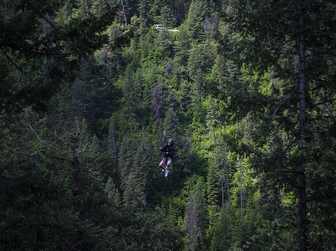 Lake City High School student Gunnar Nickerson zips across the last zip line during an academic field trip Thursday morning to Timberline Adventures by Beauty Bay. (LOREN BENOIT/Press)