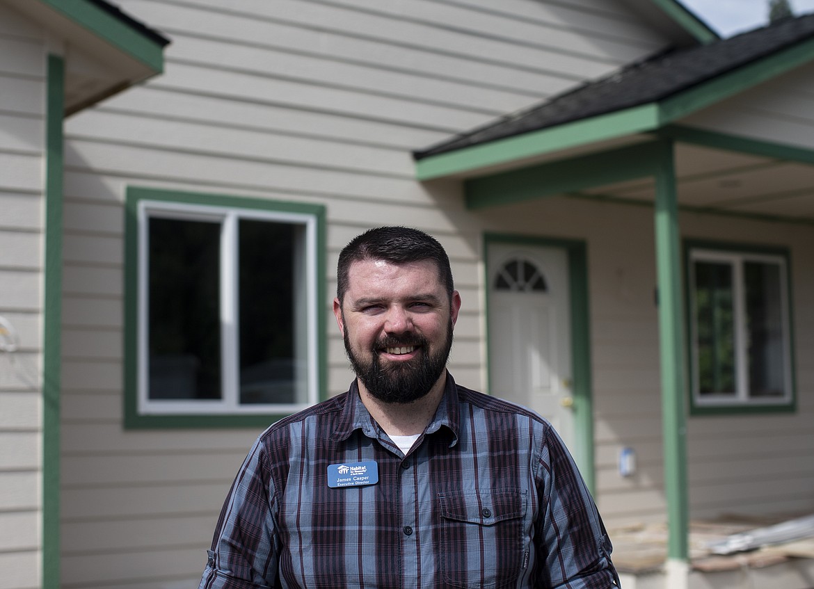 LOREN BENOIT/Press
James Casper, executive director of Habitat for Humanity of North Idaho, poses for a portrait outside a Post Falls home for Nathan Smalley, a Special Olympian who earned gold and silver medals in skiing in Austria last year. More than 100 volunteers have been working on the house, which will be ready in June.