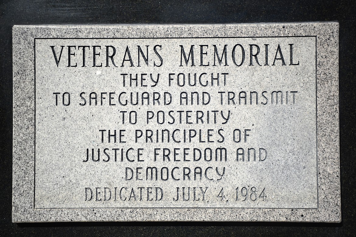 Detail of the dedication plaque of the Veterans Memorial. Since 2014, the Flathead Marines have been volunteering to take care of the monument year round which includes cleaning it and taking care of snow removal in winter. But the monument gets a bit of extra care and shine before Memorial Day and Veterans Day.(Brenda Ahearn/Daily Inter Lake)