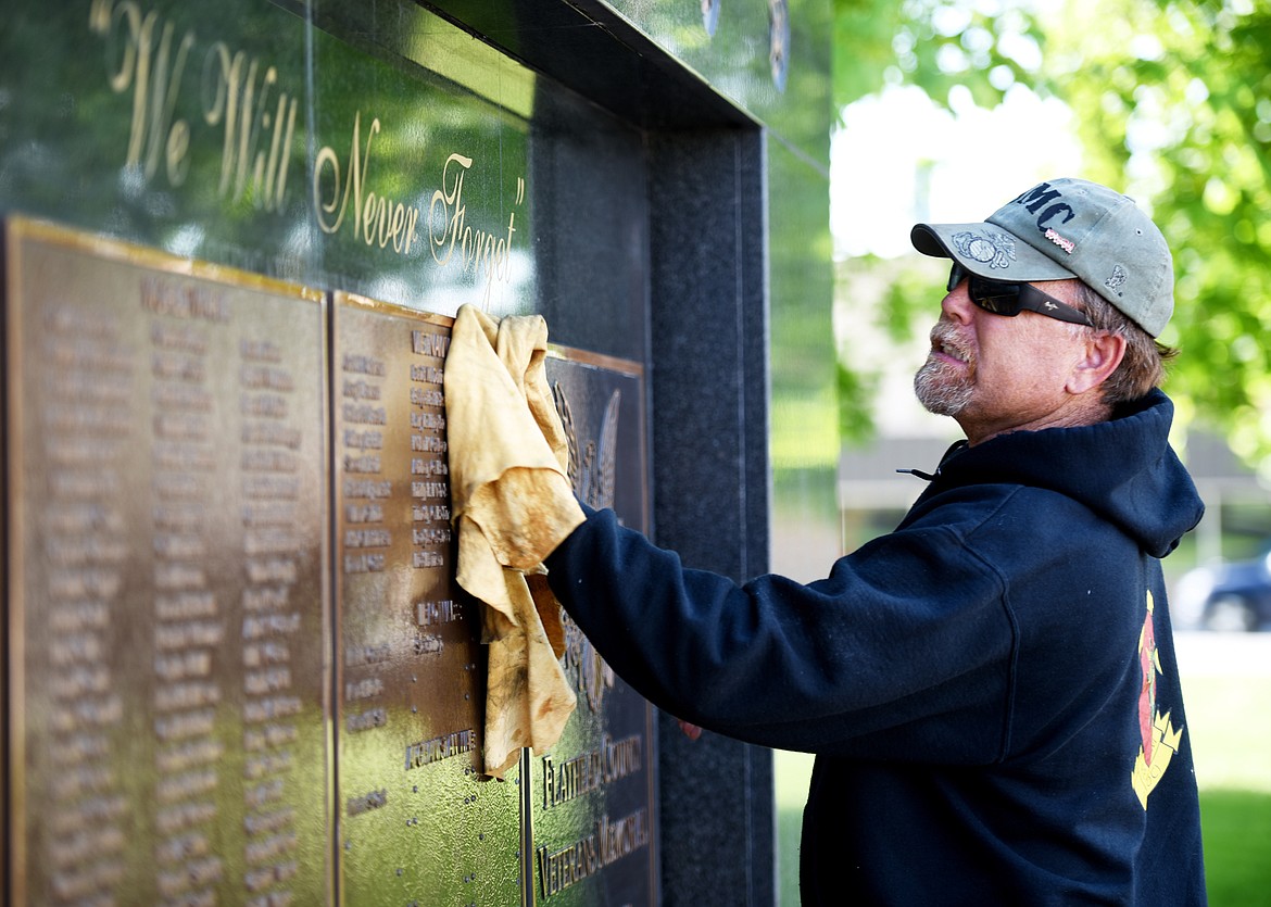 Sean Reynolds of the Flathead Marines polishes the Veterans Memorial. Since 2014, the Flathead Marines have taken care of the monument year-round, but it gets a bit of extra care and shine before Memorial Day and Veterans Day.