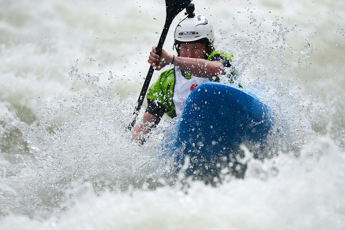 Kayakers navigate the Swan River during the Expert Slalom event at the Bigfork Whitewater Festival in Bigfork on Saturday. (Casey Kreider/Daily Inter Lake)