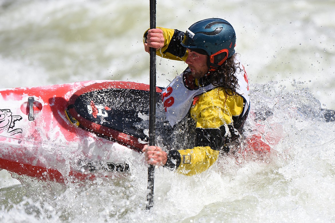 Kayakers navigate the Swan River during the Expert Slalom event at the Bigfork Whitewater Festival in Bigfork on Saturday. (Casey Kreider/Daily Inter Lake)