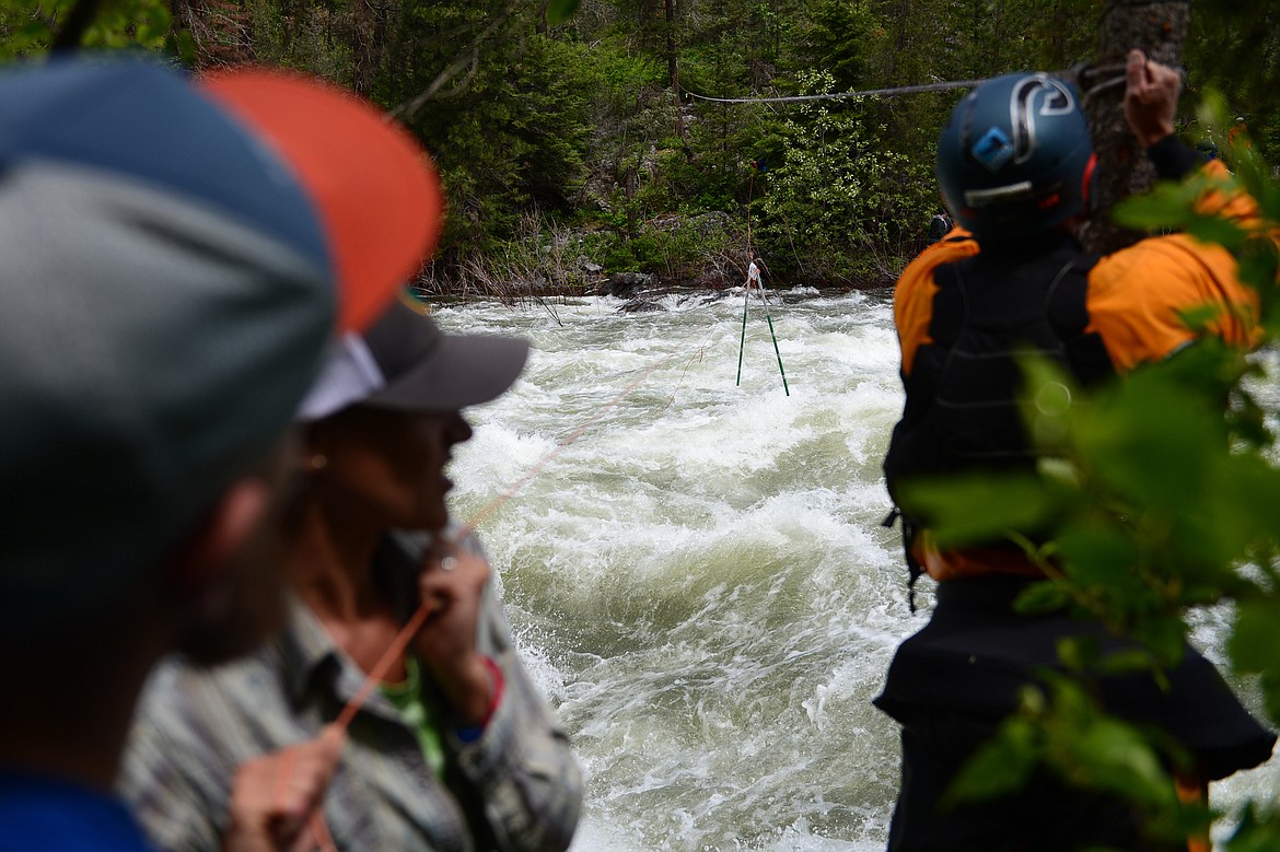 Festival organizers work to adjust a gate on a section of rapids along the Swan River during the Bigfork Whitewater Festival on Saturday. (Casey Kreider/Daily Inter Lake)