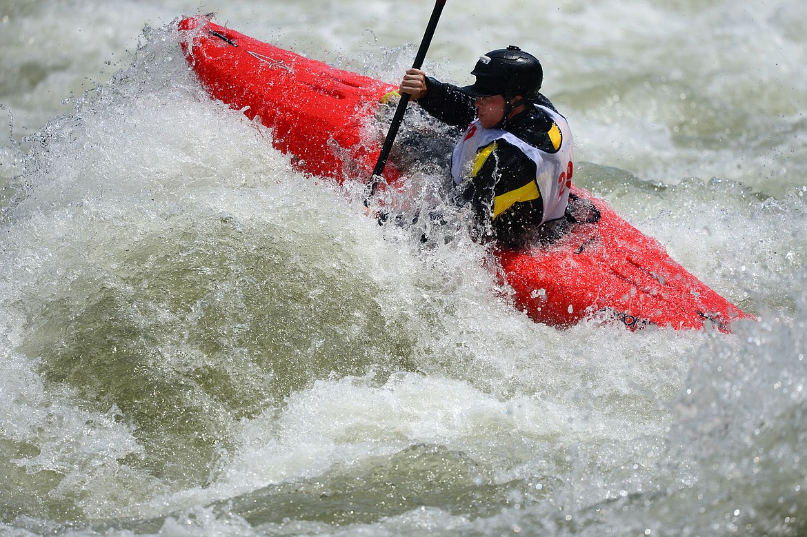 Kayakers navigate the Swan River during the Expert Slalom event at the Bigfork Whitewater Festival in Bigfork on Saturday. (Casey Kreider/Daily Inter Lake)