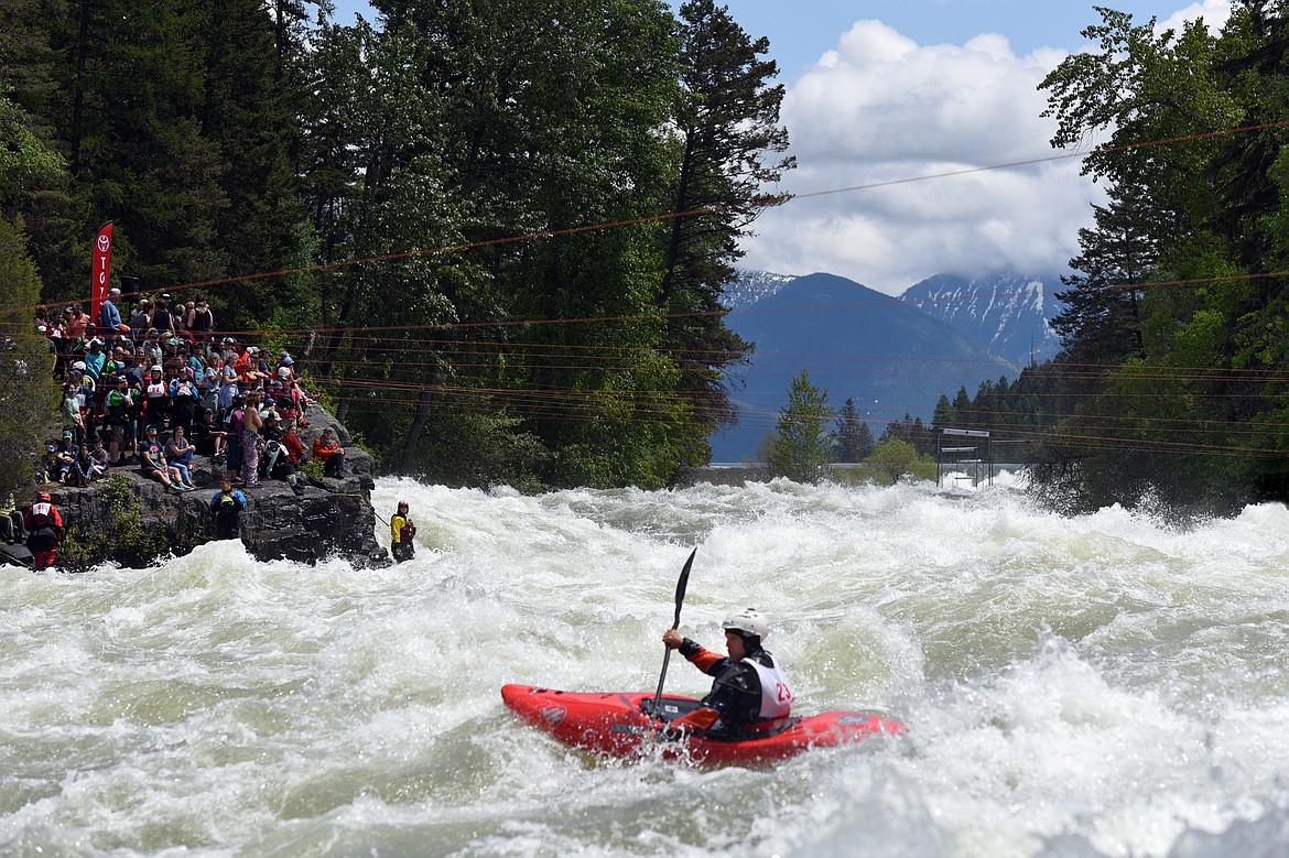 Kayakers navigate the Swan River during the Expert Slalom event at the Bigfork Whitewater Festival in Bigfork on Saturday. (Casey Kreider/Daily Inter Lake)