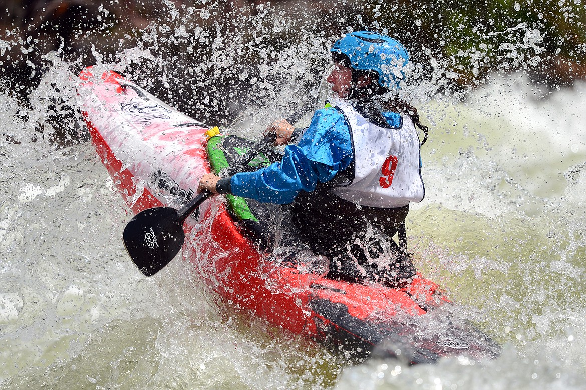 Kayakers navigate the Swan River during the Expert Slalom event at the Bigfork Whitewater Festival in Bigfork on Saturday. (Casey Kreider/Daily Inter Lake)